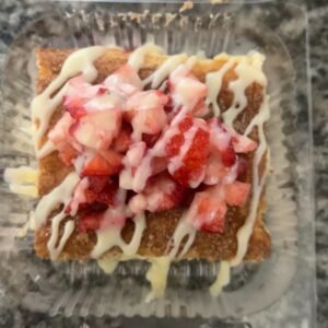 Churro cheese cake slice w/ strawberry and lechera